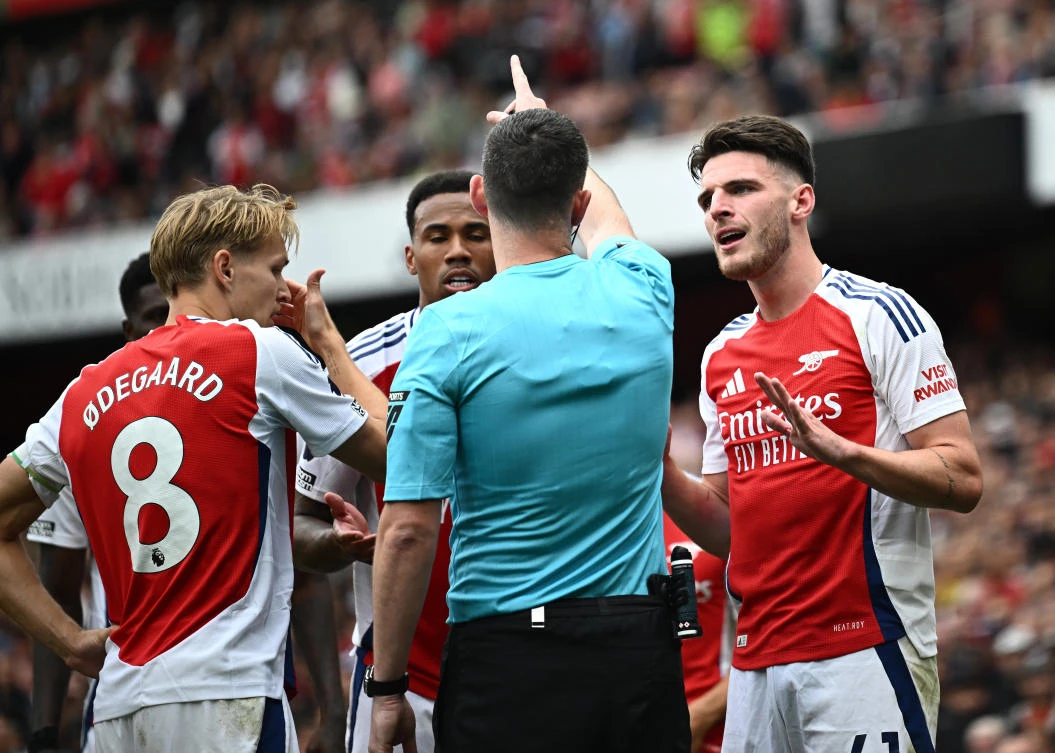 Arsenal’s Declan Rice reacts after being shown a second yellow card before being shown a red card. (Reuters)