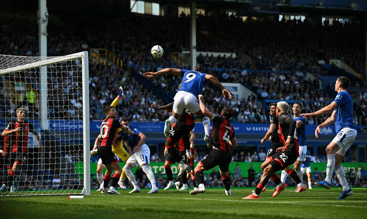 Everton's English striker #09 Dominic Calvert-Lewin jumps for a header during the English Premier League football match between Everton and Bournemouth at Goodison Park in Liverpool, north west England on August 31, 2024. (AFP)