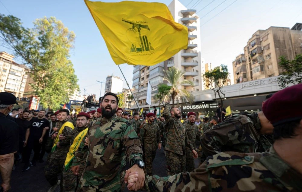 Hezbollah members during the funeral procession of commander Fuad Shukr in Beirut's southern suburbs, Aug. 1, 2024. (AFP)