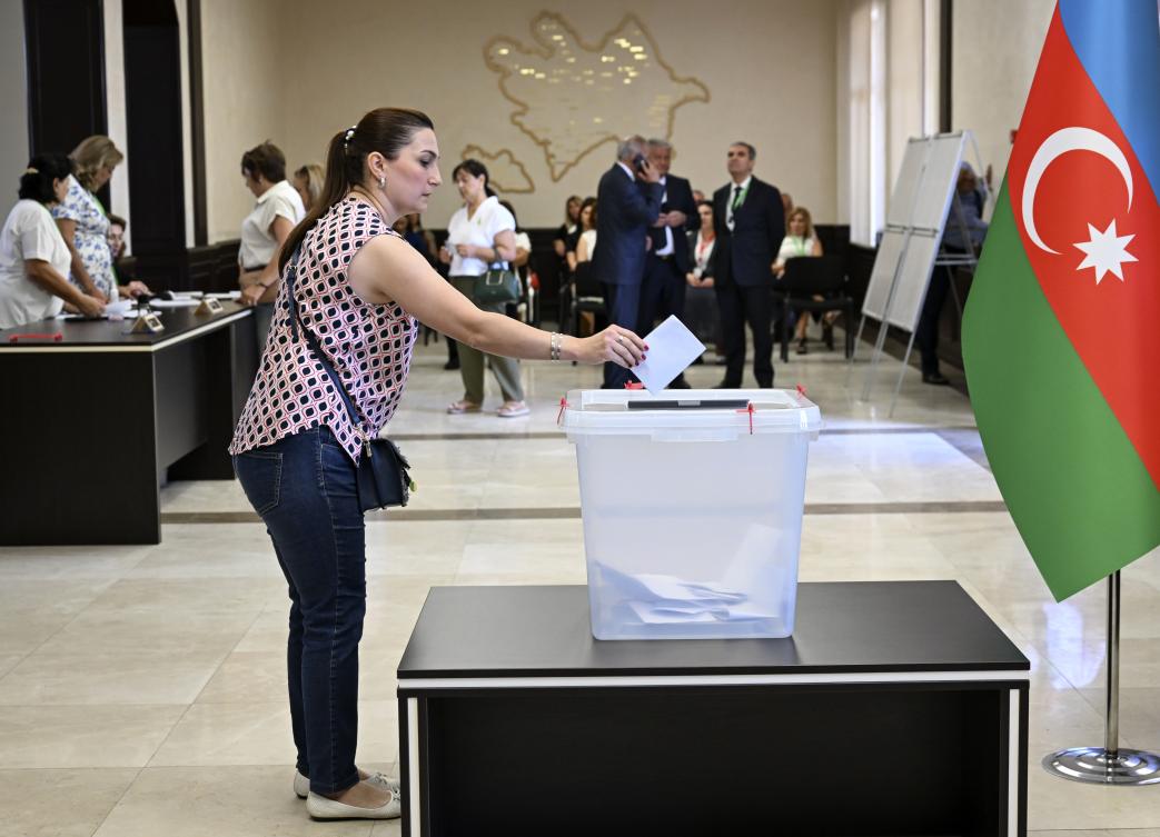 A woman casts her ballot during the parliamentary elections in Baku, Azerbaijan, 01 September 2024.