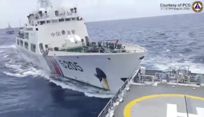 In this image taken from handout video provided by the Philippine Coast Guard, a Chinese Coast Guard ship with bow number 5205, right, collides with Philippine Coast Guard vessel BRP Teresa Magbanua near the Sabina Shoal at the disputed South China Sea on Aug. 31, 2024. (Philippine Coast Guard via AP)