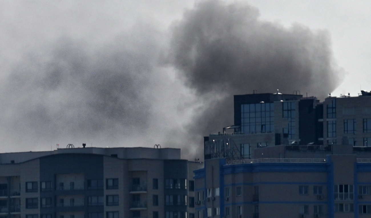 This photograph shows smoke rises over buildings, following a Russian drones attack in Kyiv, on August 26, 2024. (AFP/File)