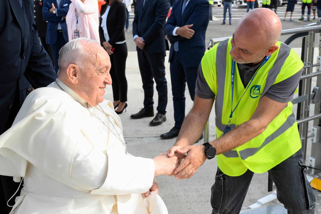 Pope Francis, seated on a wheelchair, boards his plane heading to Indonesia on September 2, 2024 at Rome’s Fiumicino airport. (AFP)