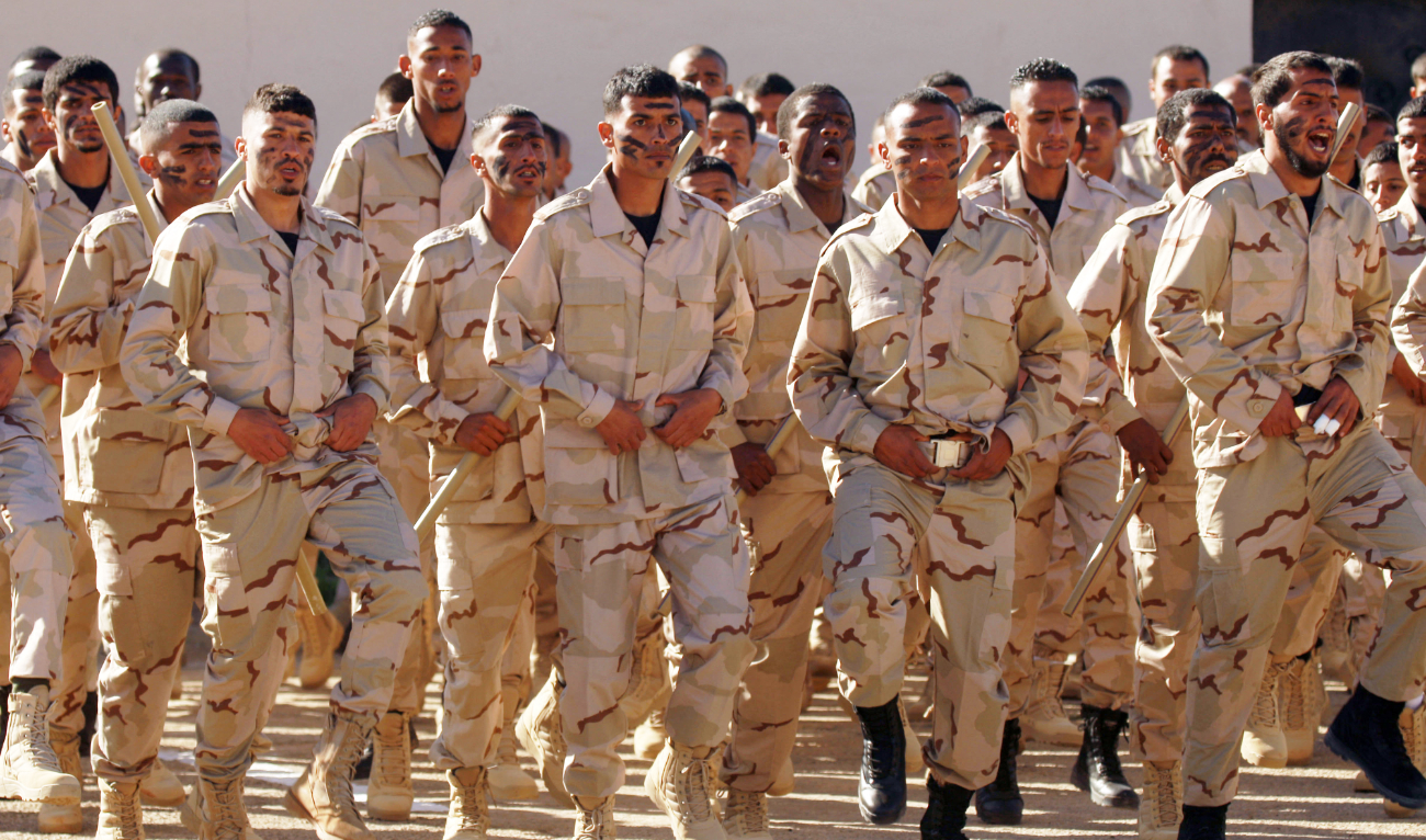 Cadets of the "Saiqa" force (Special Forces) of the self-styled Libyan National Army (LNA) affiliated with eastern strongman Khalifa Haftar take part in a graduation ceremony, in the eastern city of Benghazi, on January 20, 2022. (AFP/File)