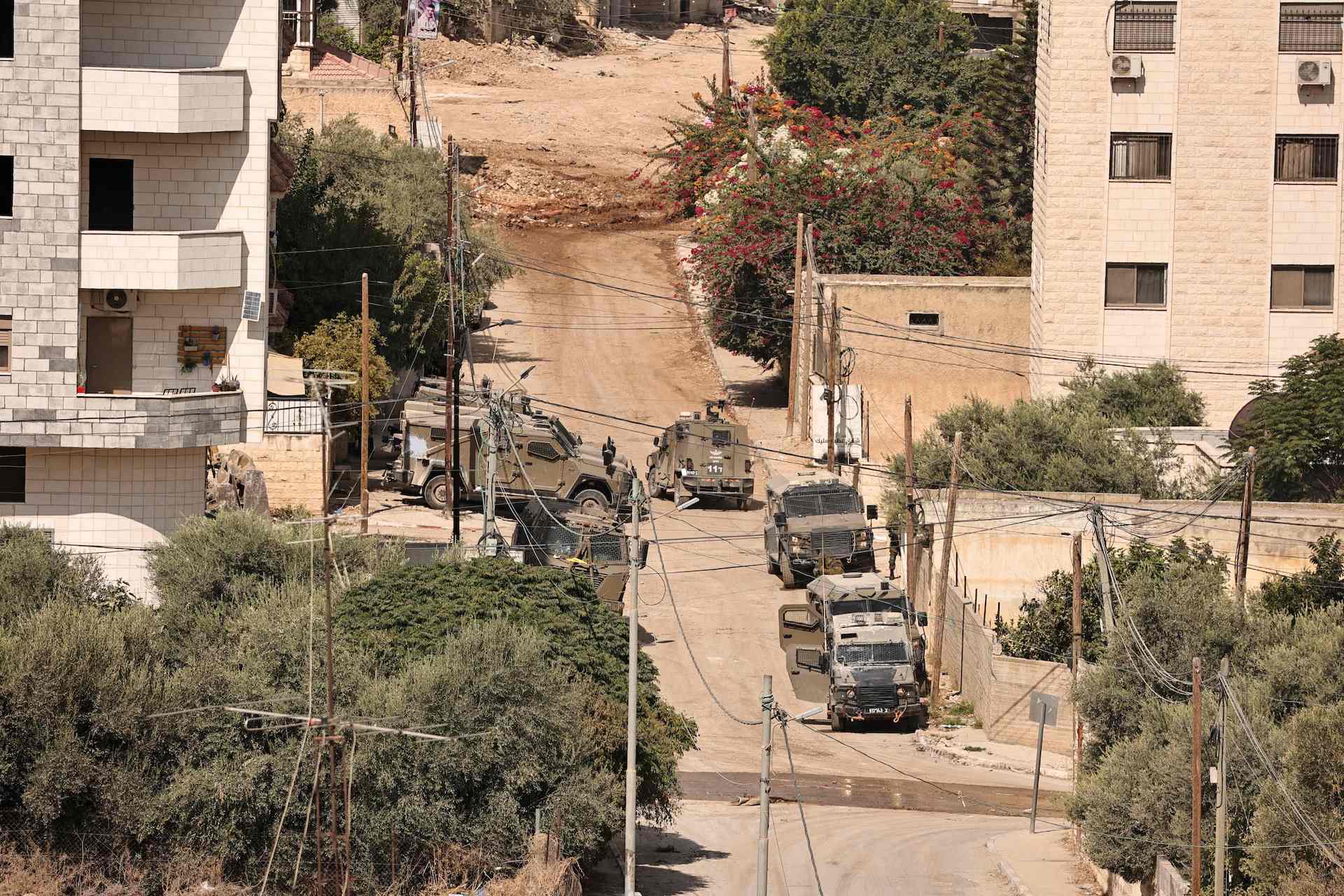 Israeli troops take position in the centre of Jenin during a raid on the Palestinian city on September 3, 2024, amid a large-scale military offensive launched a week earlier in the north of the occupied West Bank. (AFP)