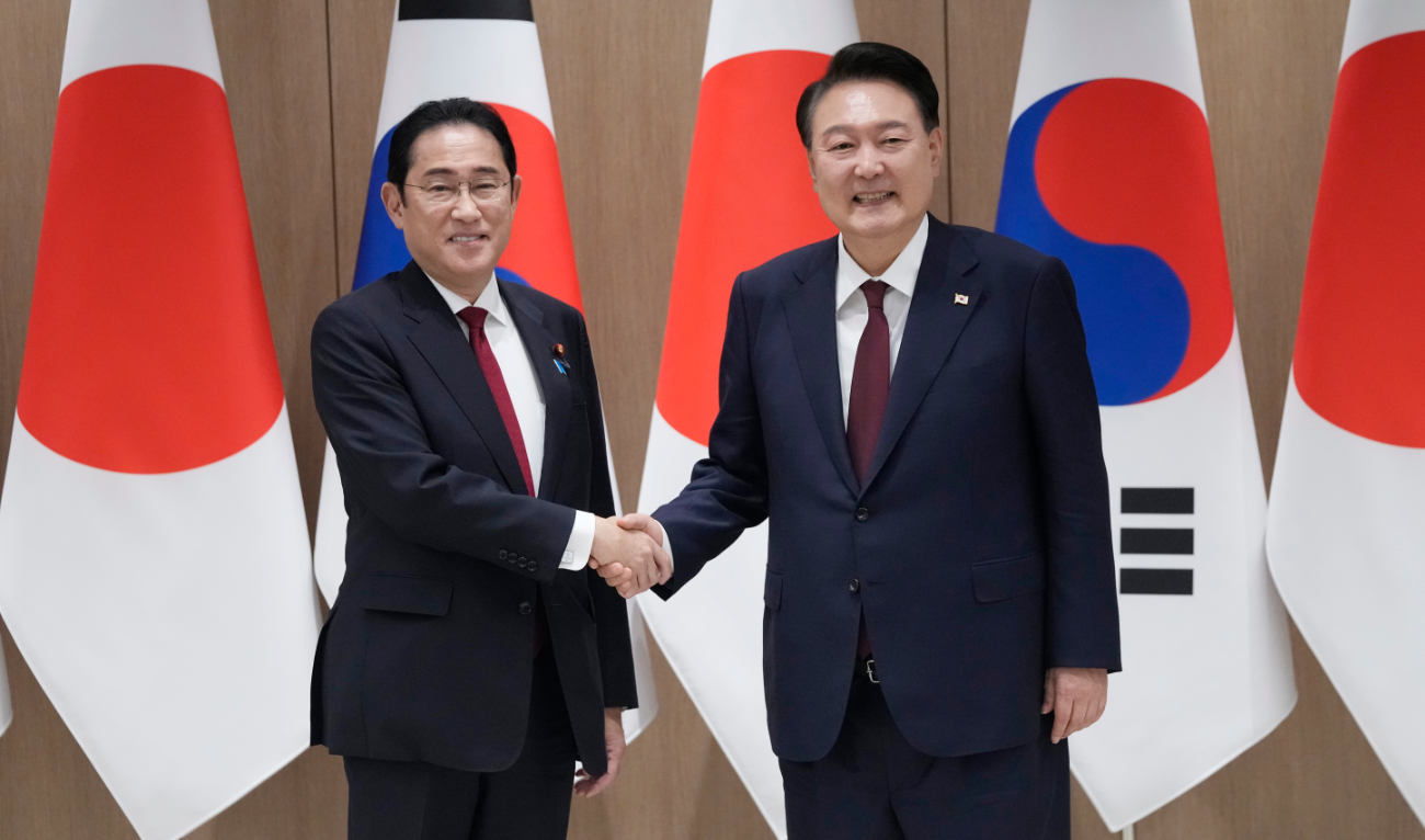 South Korean President Yoon Suk Yeol shakes hands with Japanese Prime Minister Fumio Kishida during a meeting at the Presidential Office in Seoul, South Korea, on May 26. (File/AP)