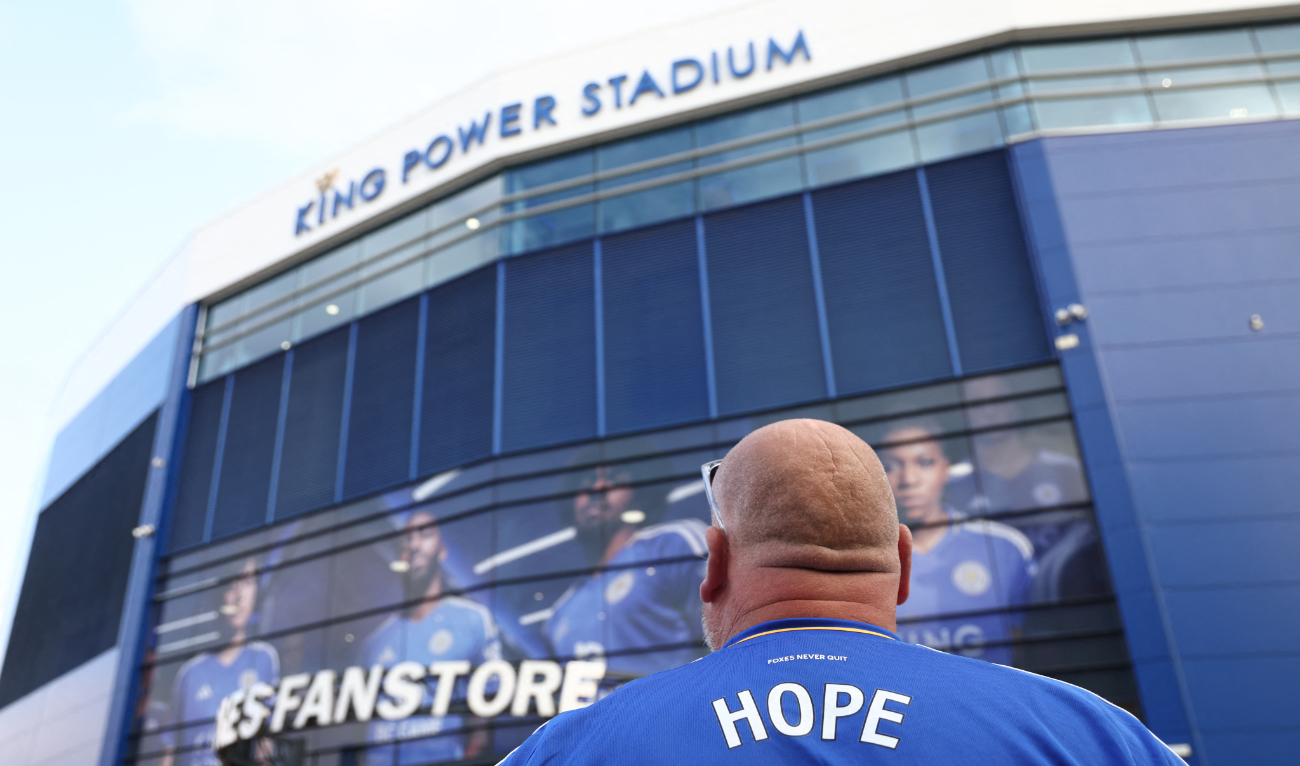 Fans arrive at the stadium ahead of the English Premier League football match between Leicester City and Tottenham Forest at King Power Stadium in Leicester, central England on August 19, 2024. (AFP)
