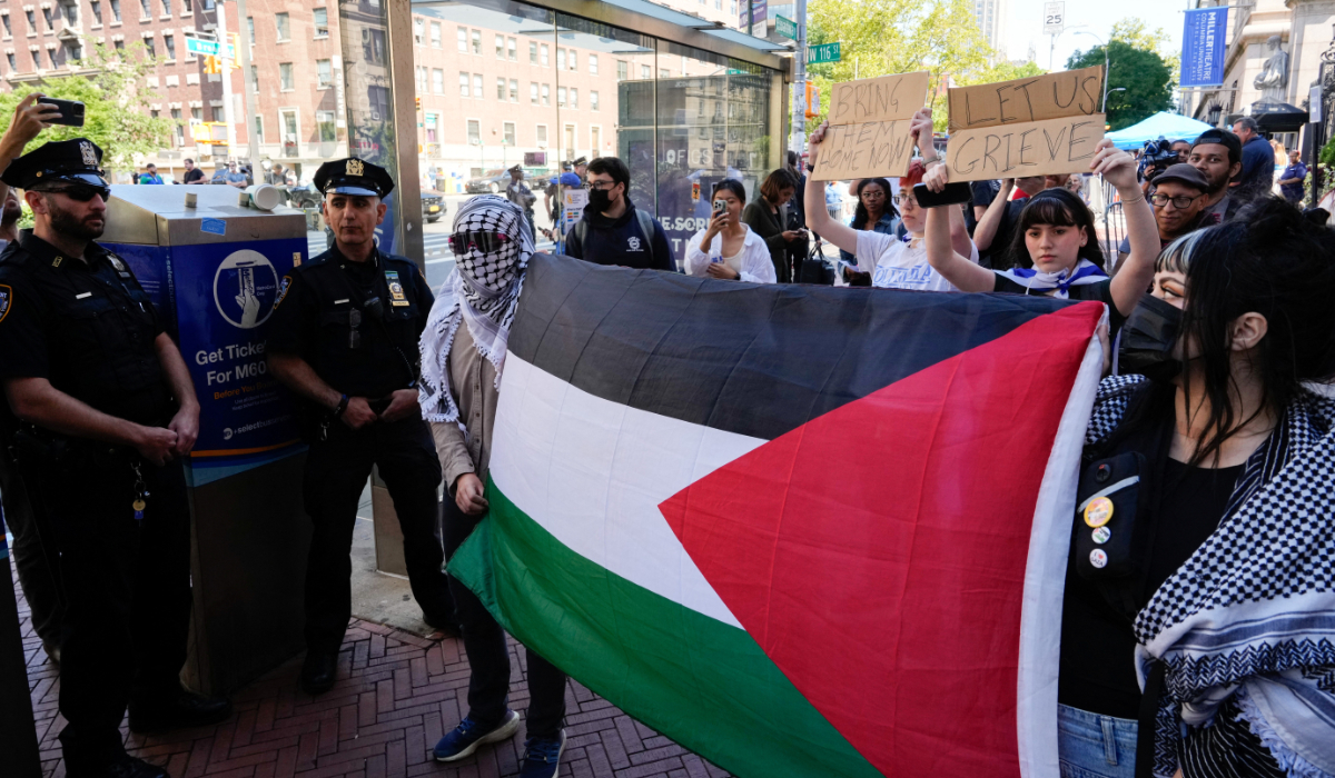 Freshman Columbia and Barnard students Lila and Shoshana, who are Jewish, hold up signs as they counter-protest pro-Palestine supporters outside of Columbia University on the first day of the new semester in New York City, U.S., September 03, 2024. (REUTERS)