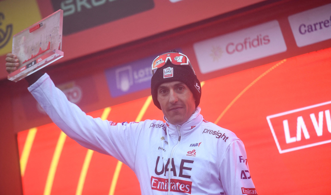 Team UAE's Marc Soler celebrates on the podium after winning stage 16 of the Vuelta a España, a 181,5 km race between Luanco and Lagos de Covadonga, on Sept. 3, 2024. (AFP)