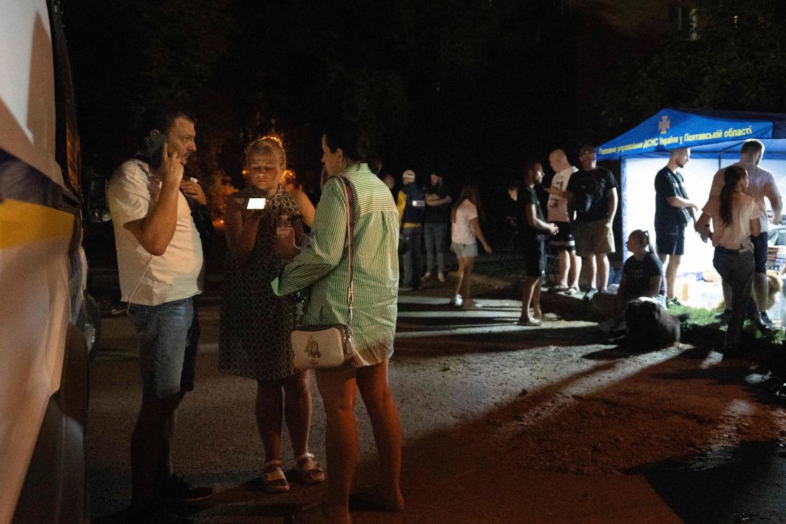 Medical workers and psychologists provide assistance and support to local residents and victims in the neigbourhood where a military educational facility was hit by Russian missiles in Poltava, eastern Ukraine on September 3, 2024, amid the Russian invasion of Ukraine. (AFP)