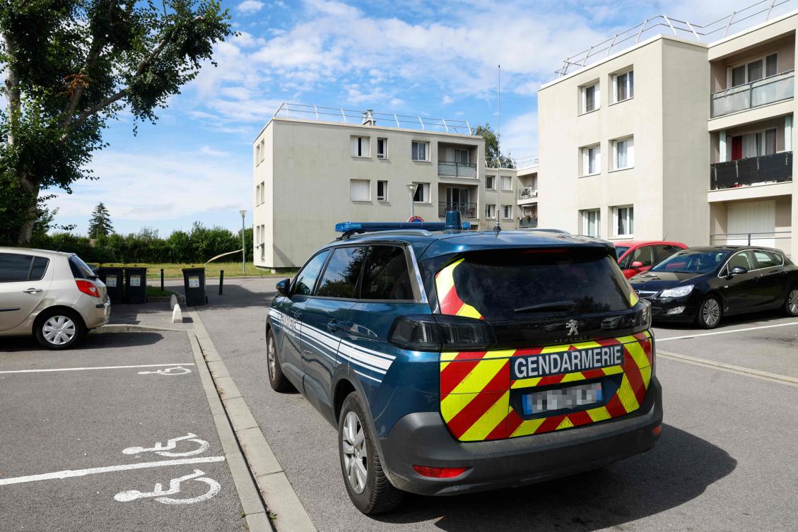 A French Gendarmerie vehicle is parked near a building complex where an individual killed his partner and their two children and injured two pedestrians in a nearby street during knife attack before being arrested shortly after, in the town of Mormant, on Sept. 7, 2024. (AFP)