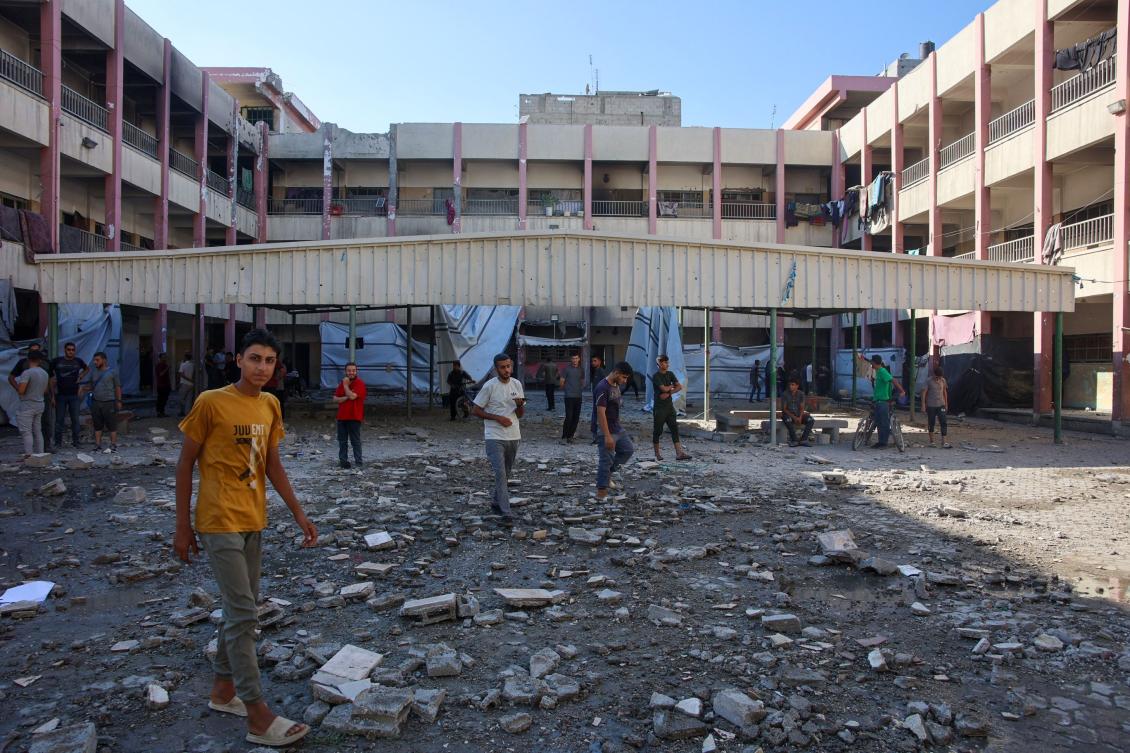 People inspect the damage following an Israeli strike on Amr Ibn al Aas school housing displaced Palestinians in the Sheikh Radwan neighborhood in Gaza City on September 7, 2024. (AFP)