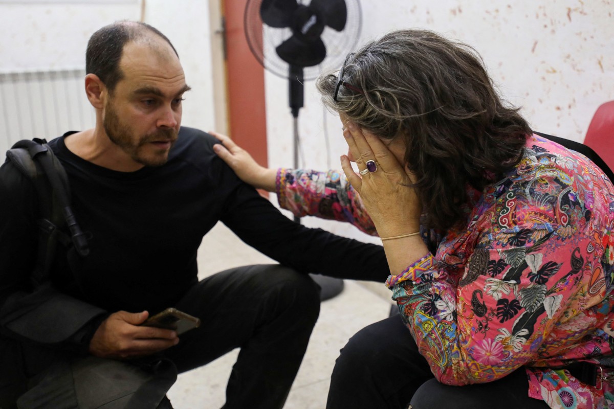 Colleagues of Aysenur Ezgi Eygi, US-Turkish activist who died after reportedly being shot in the West Bank town of Beita, react on news of her death in a hospital in Nablus in the occupied West Bank on September 6, 2024. (AFP)