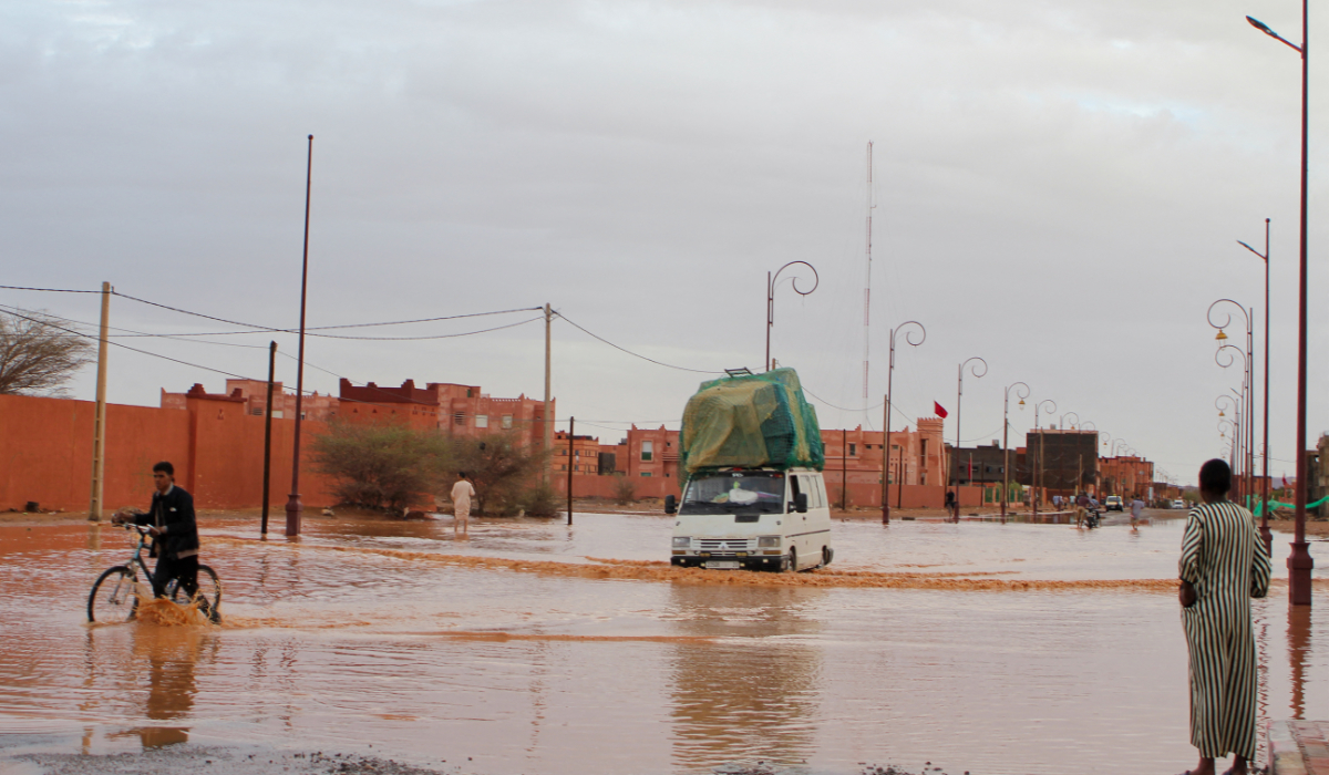 A car drives through a flooded street after flooding in Morocco's region of Zagora on September 7, 2024. (AFP)