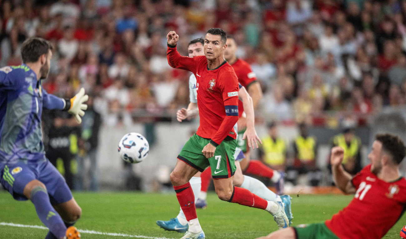 Portugal's forward Cristiano Ronaldo (C) scores a goal during the UEFA Nations League football match, Group A, between Portugal and Scotland at Luz stadium in Lisbon on Sept. 8, 2024. (AFP)