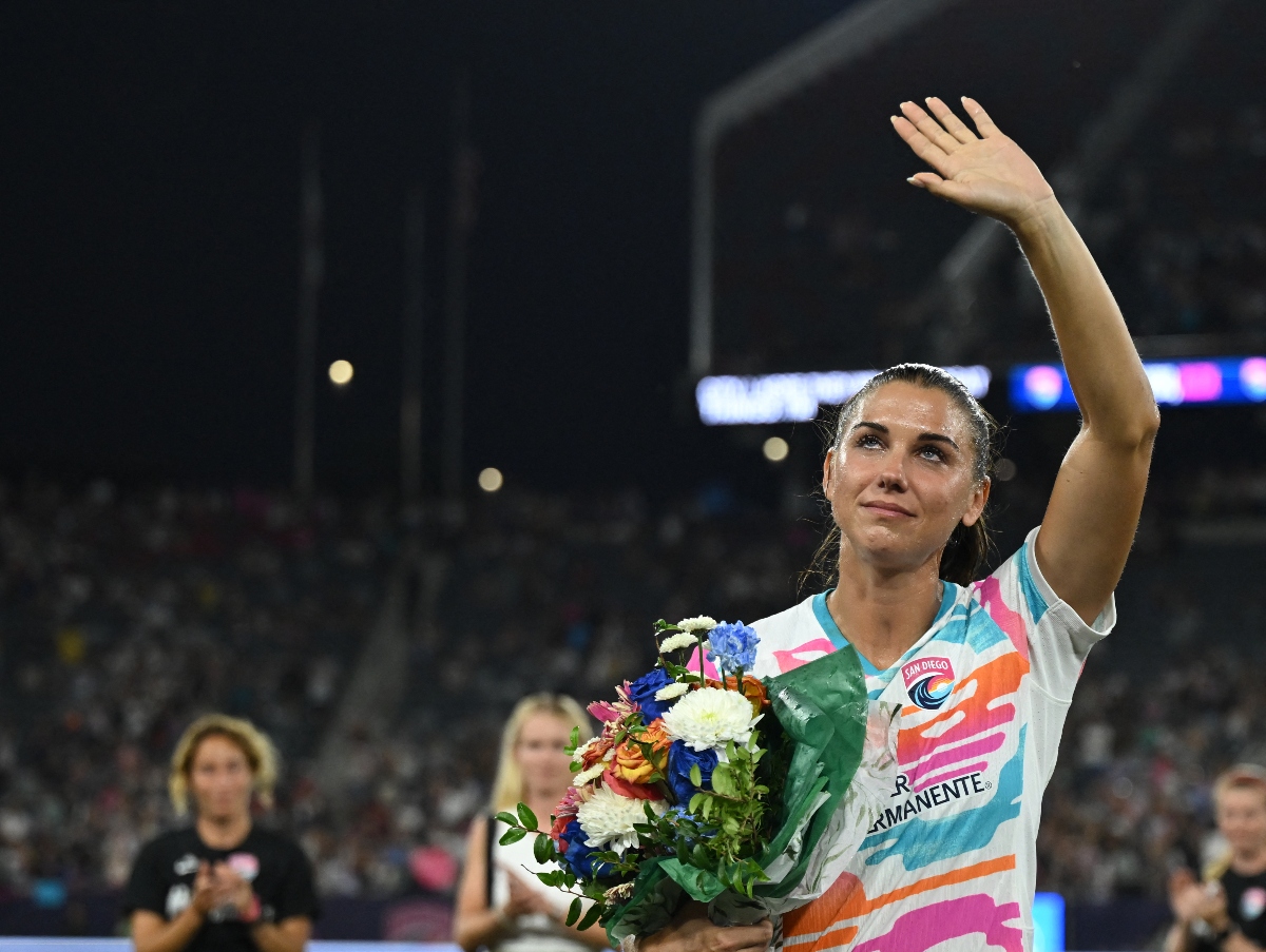 San Diego Wave FC forward Alex Morgan waves to fans following her final match before retirement between San Diego Wave FC and the North Carolina Courage at Snapdragon Stadium Sunday. (USA TODAY Sports)