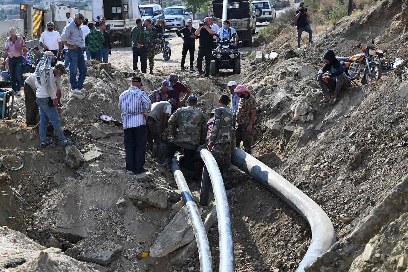 Syrians inspect the damage at the site of overnight Israeli strikes on the outskirts of Masyaf in Syria’s central Hama province on September 9, 2024. (AFP)