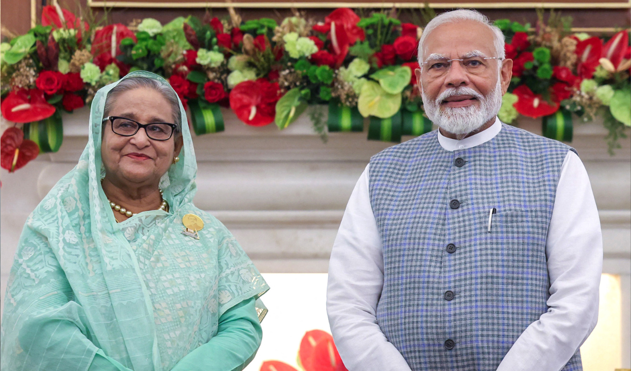 This handout photograph taken and released on June 22, 2024 by the Indian Press Information Bureau (PIB) shows India's Prime Minister Narendra Modi and Bangladesh's ousted Prime Minister Sheikh Hasina (L) posing for photos during a meeting at the Hyderabad house in New Delhi. (AFP/File)