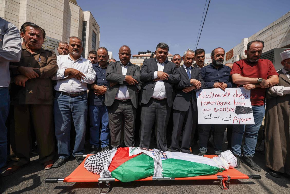 Palestinians pray by the body of slain Turkish-American International Solidarity Movement activist Aysenur Ezgi Eygi during a funeral procession in Nablus in the occupied West Bank on September 9, 2024. (AFP)