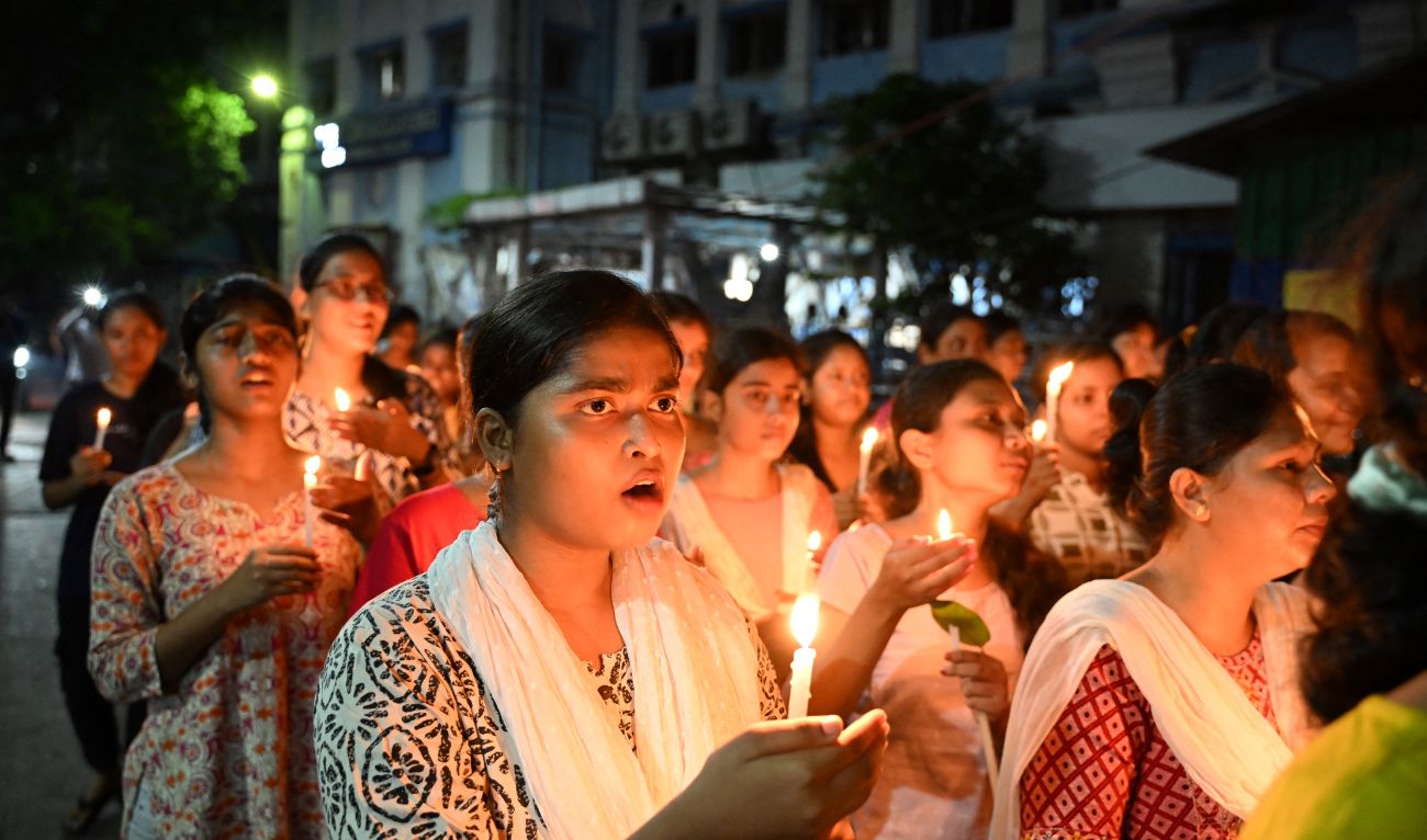Health professionals along with nursing students hold lit candles during a demonstration to condemn the rape and murder of a doctor, at the RG Kar Medical College and Hospital in Kolkata on September 4, 2024. (AFP/File)
