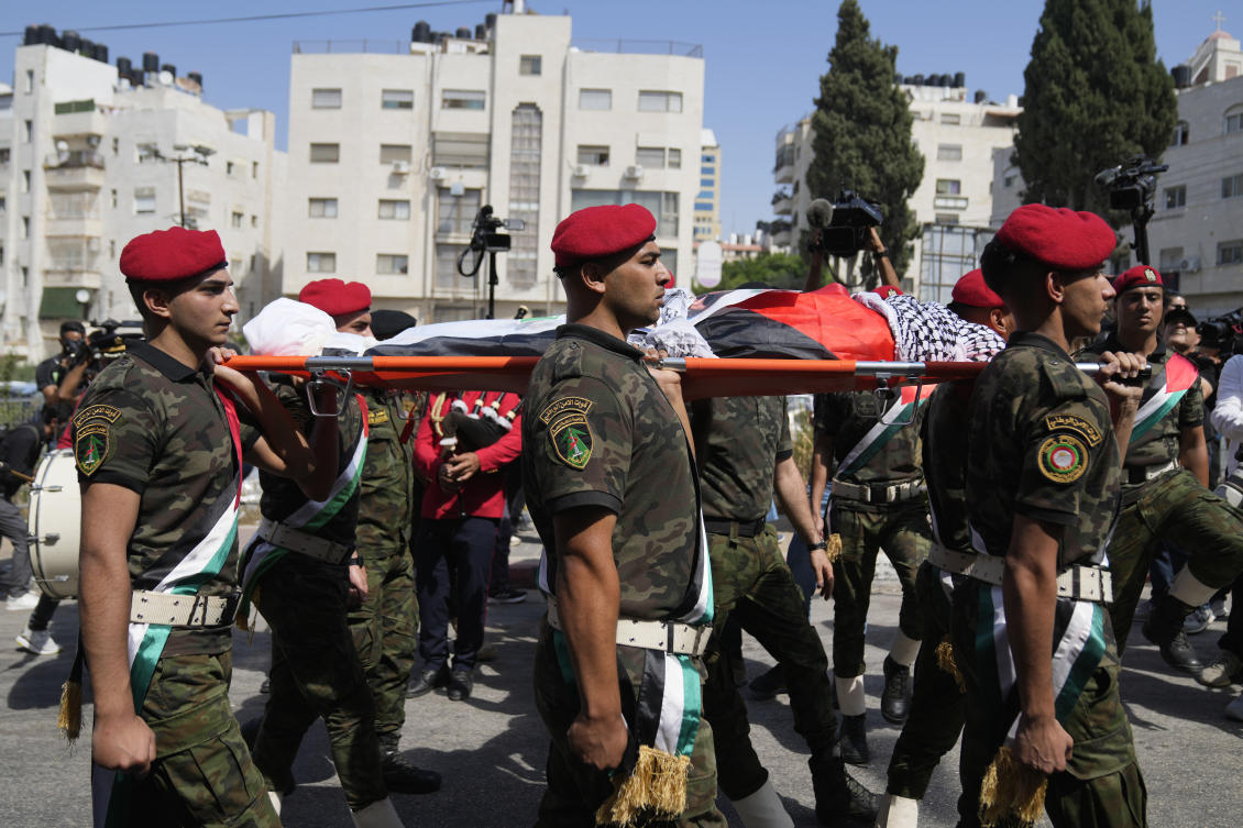 A Palestinian honor guard carries the body of Aysenur Ezgi Eygi, 26, who a witness says was fatally shot by Israeli soldiers while participating in an anti-settlement protest in the West Bank, during her funeral procession in the West Bank city of Nablus, Monday, Sept. 9, 2024. (AP)
