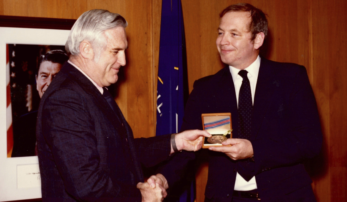 This photograph released by the CIA on behalf of the family of former CIA officer Edward B. Johnson shows Johnson, right, receiving the CIA's Intelligence Star from John N. McMahon, then the agency's deputy director for operations, in May 1980. (AP)