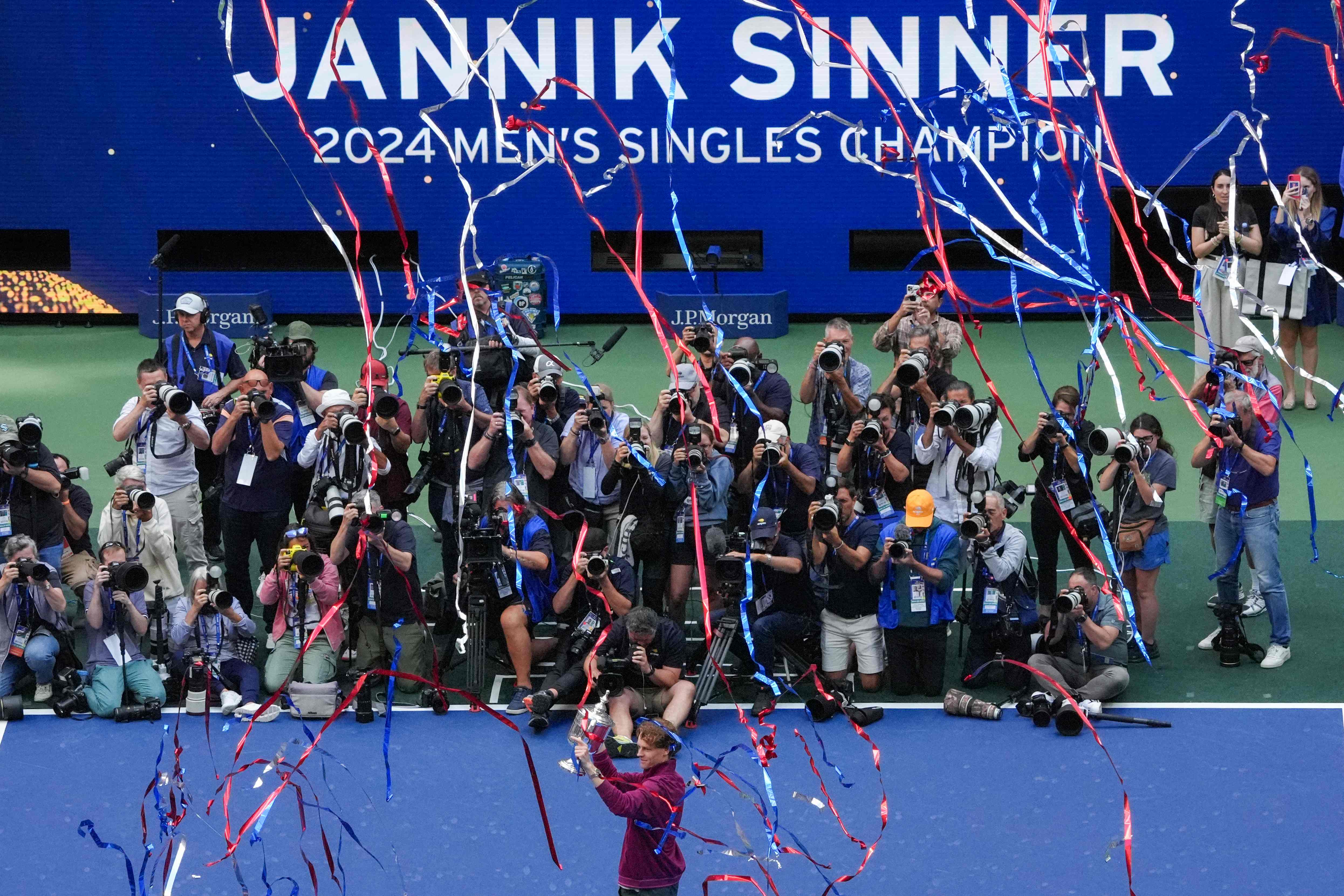 Italy's Jannik Sinner poses with the trophy after winning his men's final match against USA's Taylor Fritz on Day 14 of the US Open tennis tournament at the USTA Billie Jean King National Tennis Center in New York City, on Sept. 8, 2024. (AFP)