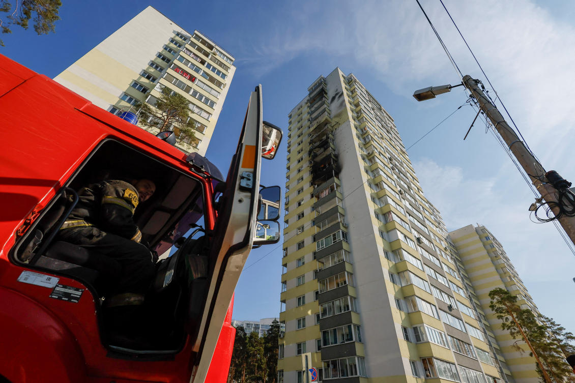 A firefighter sits in a truck near a damaged multi-story residential building following an alleged Ukrainian drone attack in Ramenskoye in the Moscow region on Sept. 10, 2024. (Reuters)