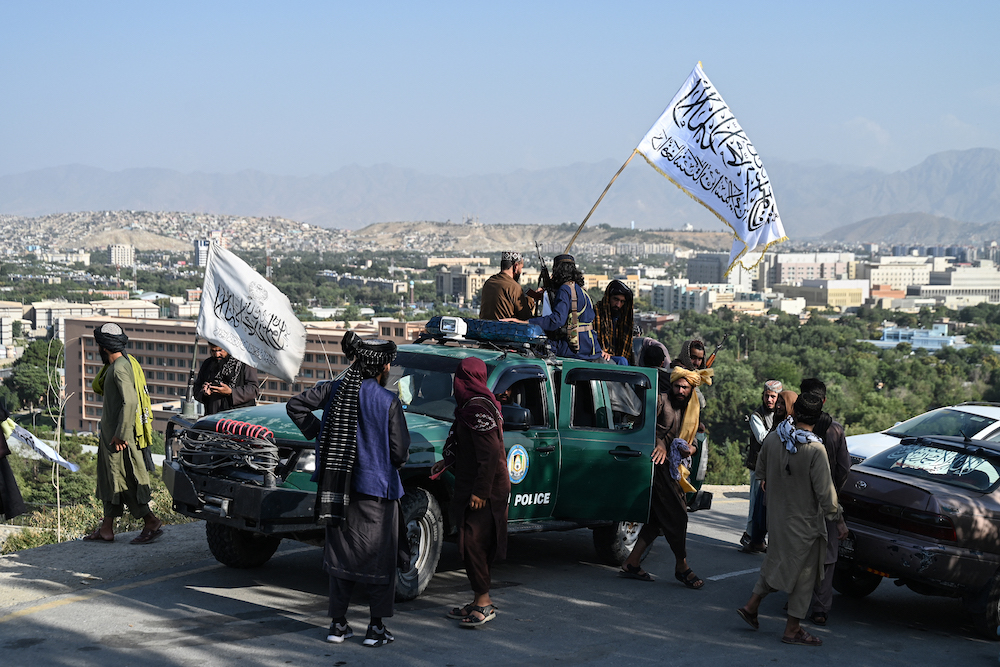 Up to 28 Afghans were sent back to Afghanistan about a week ago and were subsequently released after providing ‘written assurances.’ Above, Taliban security personnel celebrate the third anniversary of Taliban takeover of Afghanistan on Aug. 14, 2024. (AFP)