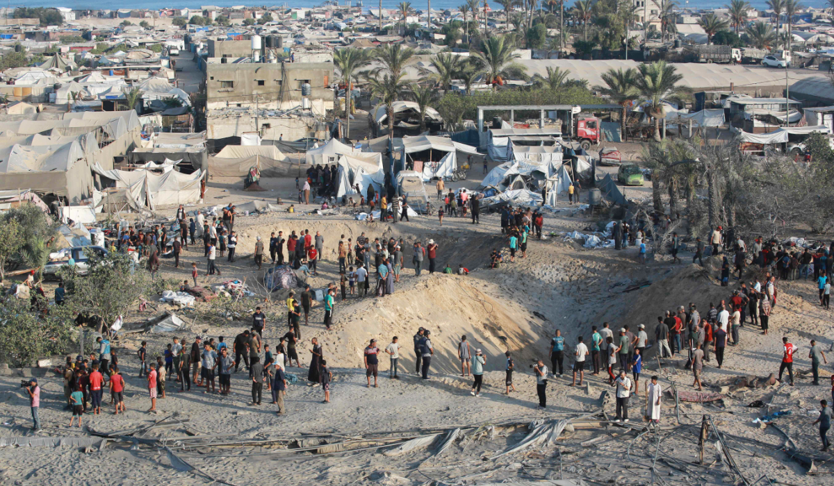 Palestinians inspect the damage at the site of Israeli strikes on a makeshift displacement camp in Mawasi Khan Yunis in the Gaza Strip on September 10, 2024, amid the ongoing war between Israel and Palestinian militant group Hamas. (AFP)