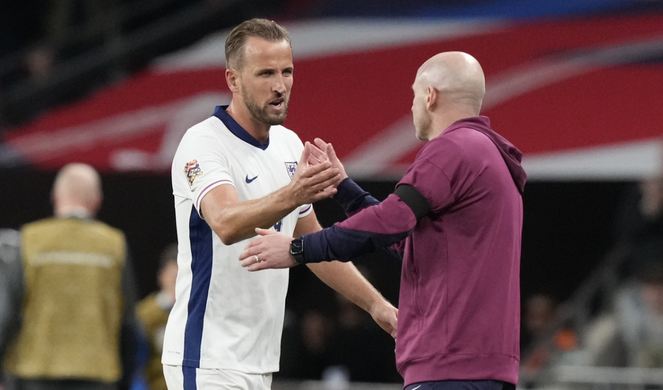 England's Harry Kane, left, is congratulated by England interim manager Lee Carsley after scoring his side's second goal during the Group F UEFA Nations League soccer match between England and Finland at Wembley Stadium in London Tuesday. (AP)