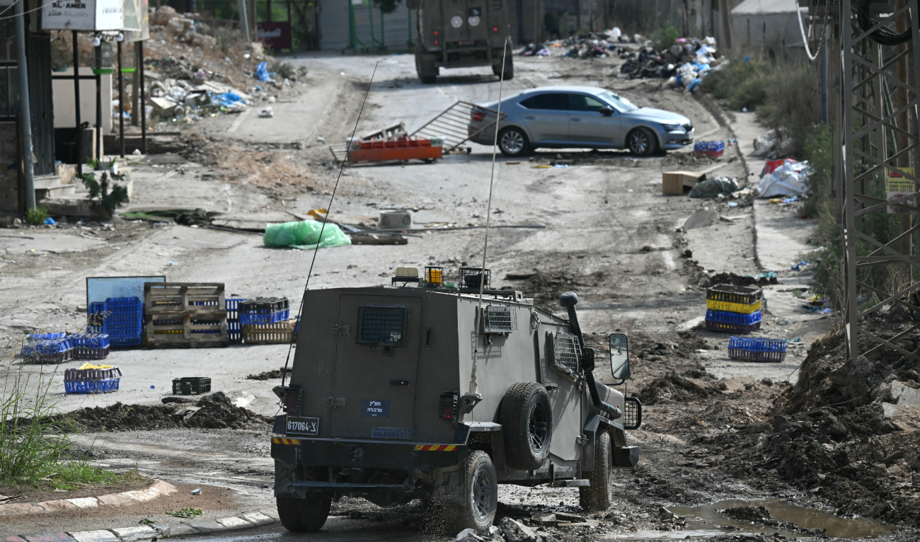 Israeli soldiers drive down a street during a raid in the Al-Faraa camp for Palestinian refugees near Tubas city in the occupied West Bank on August 28, 2024. (AFP/File)