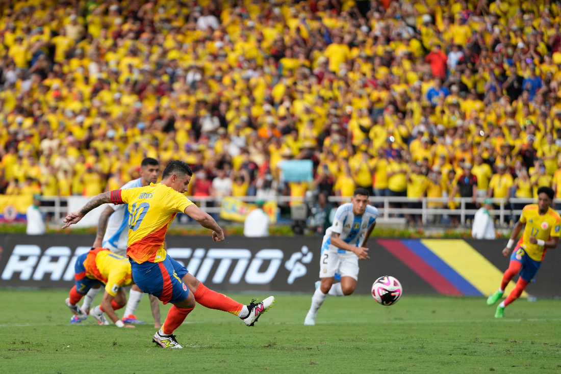 Colombia's James Rodriguez scores a penalty, his side's second goal, against Argentina during a qualifying soccer match for the FIFA World Cup 2026 at the Metropolitano Roberto Melendez stadium in Barranquilla, Colombia, Tuesday. (AP)