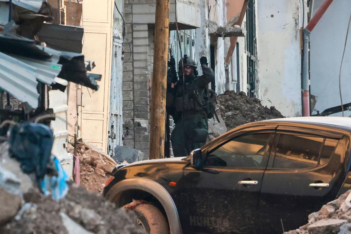 An Israeli army soldier keeps a position during a raid in Tulkarem camp amid large-scale military offensive launched a week earlier in the occupied West Bank. (File/AFP)