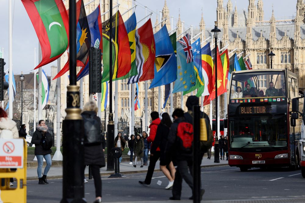 Flags representing Commonwealth countries fly next to Westminster Abbey in London, Britain, March 13, 2023. (Reuters)
