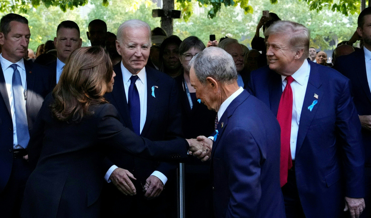 US Vice President and Democratic presidential candidate Kamala Harris (L) shakes hands with former US President and Republican presidential candidate Donald Trump (R) during a remembrance ceremony on the 23rd anniversary of the September 11 terror attack, in New York City on September 11, 2024. (AFP)
