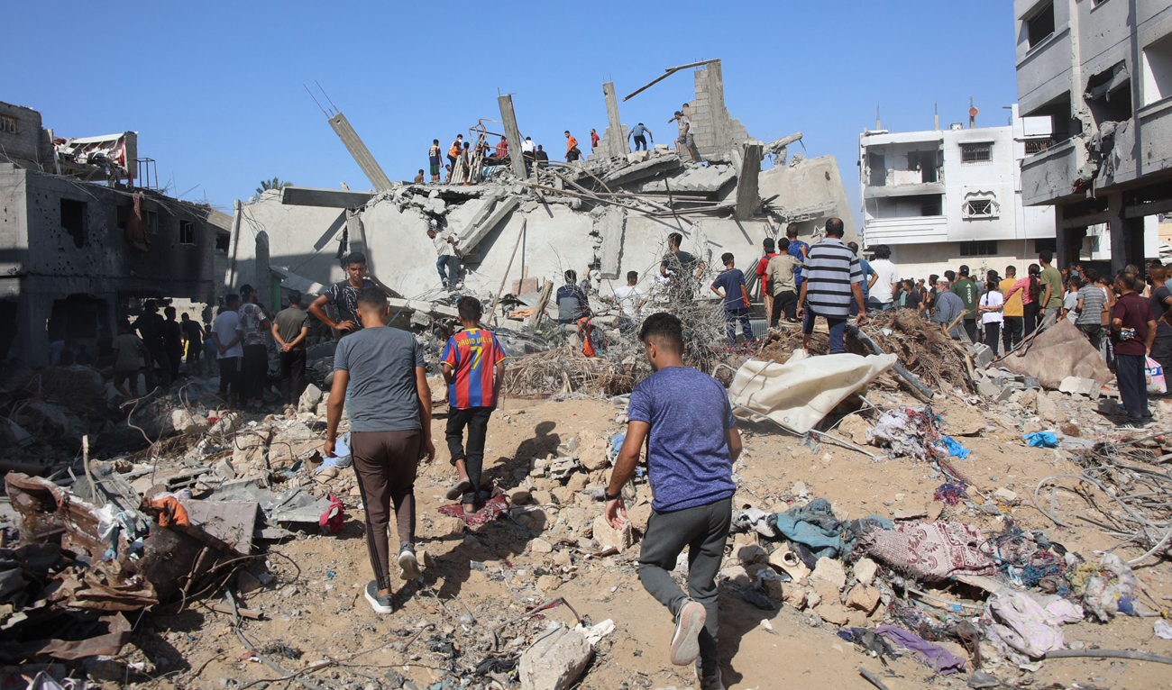 Palestinians search in the rubble for survivors at the site of an Israeli strike in the Shejaiya suburb east of Gaza City on September 12, 2024, amid the ongoing war between Israel and Hamas. (AFP)