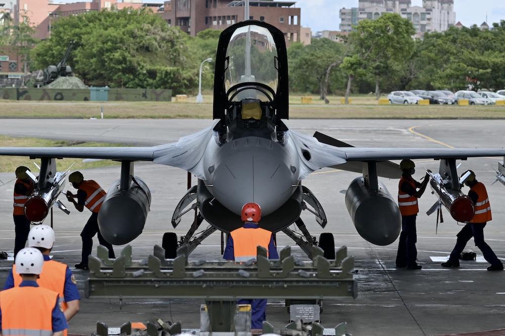 Taiwan has been converting 141 F-16A/B jets into the F-16V type and has ordered 66 new F-16Vs, which have advanced avionics, weapons and radar systems. Above, air force soldiers prepare to load anti-ship missiles in front of an F-16V fighter jet during a drill at Hualien Air Force base on Aug. 17, 2022. (AFP file photo)