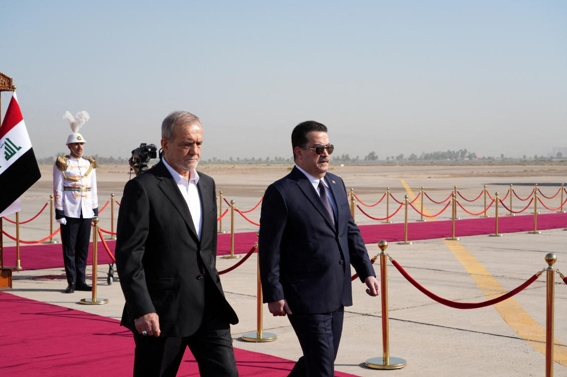 Iraqi Prime Minister Mohammed Shia Al-Sudani and Iranian President Masoud Pezeshkian walk during a welcoming ceremony at Baghdad International Airport, in Baghdad, Iraq, September 11, 2024. (REUTERS)