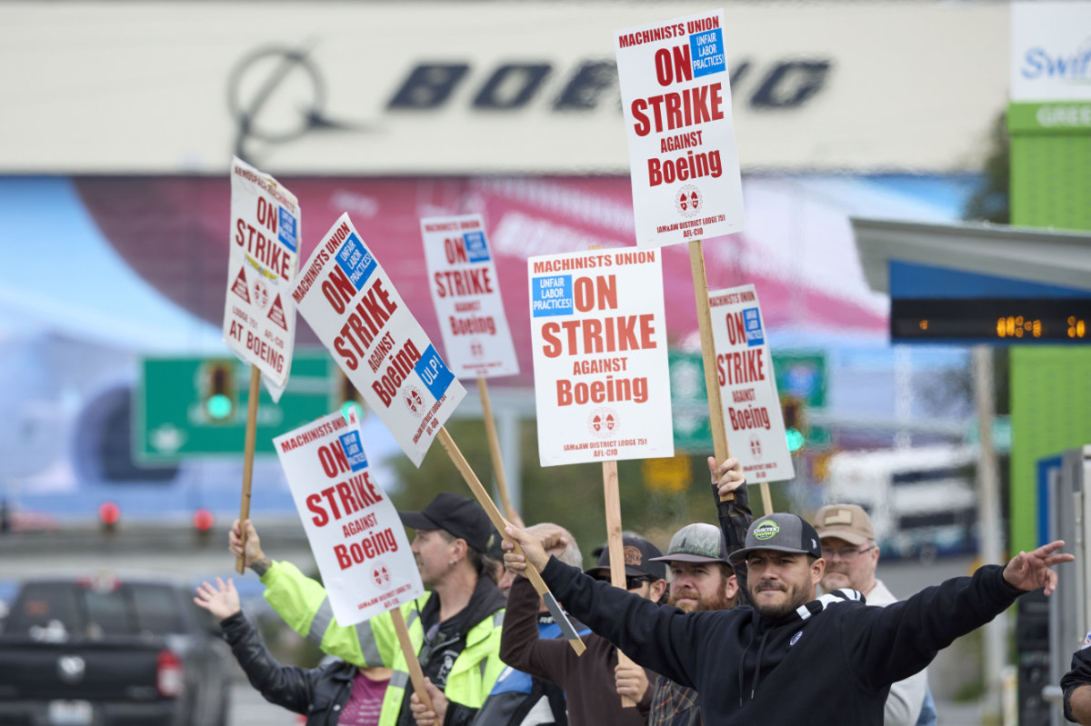 Boeing Machinists Union members wave to passing traffic on the picket line at the Boeing plant in Everett, Washington, on Sept. 13, 2024. (AP)