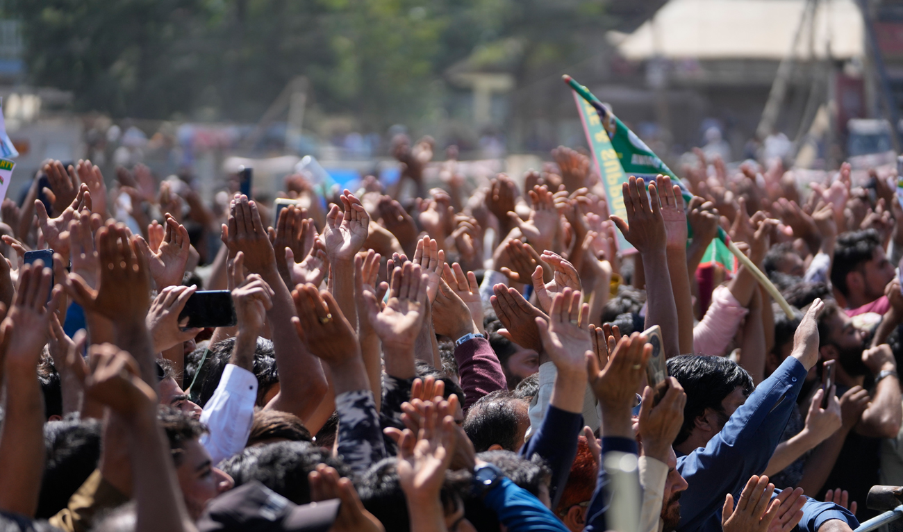 Supporters of Awami Ittehad Party (AIP) leader Sheikh Abdul Rashid cheer during a public rally at Baramulla some 55 kilometers (34 miles) north of Srinagar, Indian controlled Kashmir, Thursday, Sept. 12, 2024. (AP)