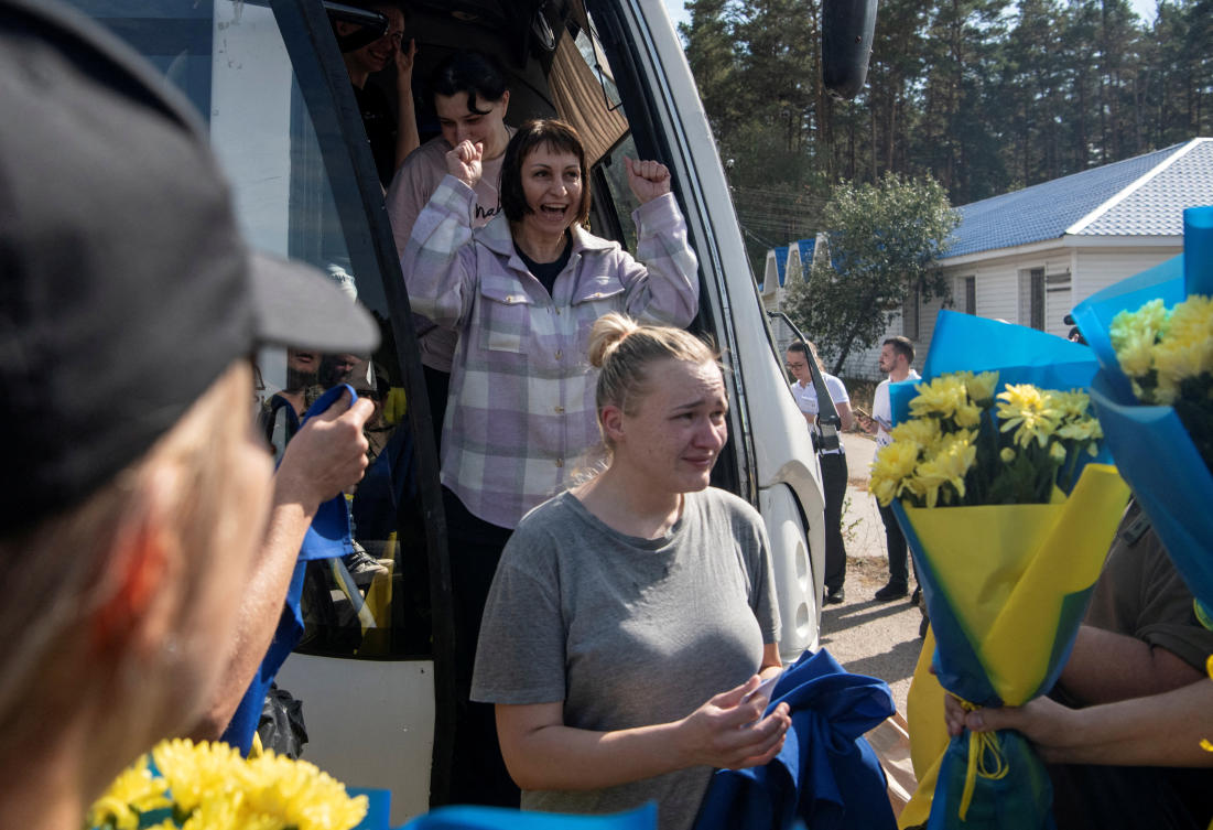Ukrainian prisoners of war (POWs) react after a swap, amid Russia's attack on Ukraine, at an unknown location in Ukraine September 13, 2024. (REUTERS)