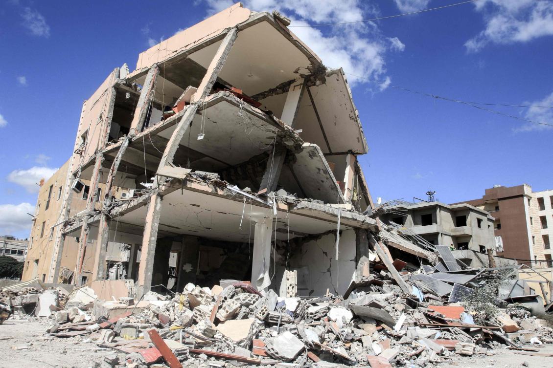 A building heavily damaged in an overnight Israeli strike stands in Kfar Rumman near the southern Lebanese town of Nabatiyeh on September 14, 2024. Lebanon’s Hezbollah has traded near-daily fire with Israeli forces in support of ally Hamas since the Palestinian militant group’s October 7 attack triggered war in the Gaza Strip, with repeated escalations during more than 11 months of the cross-border violence. (AFP)