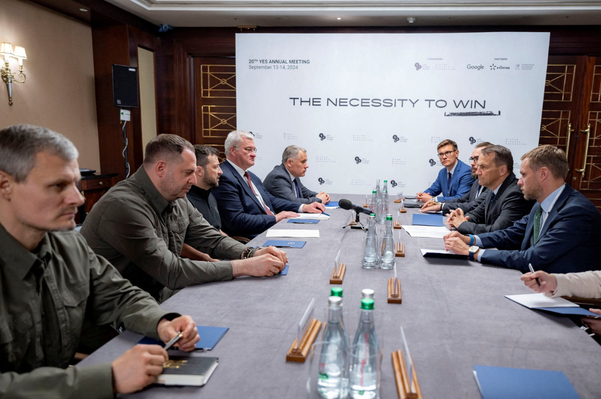 Ukraine's President Volodymyr Zelenskiy attends a meeting in Kyiv on September 13, 2024, with Polish FM Radoslaw Sikorski and Lithuanian FM Gabrielius Landsbergis. (Ukrainian Presidential Press Service/Handout via REUTERS)
