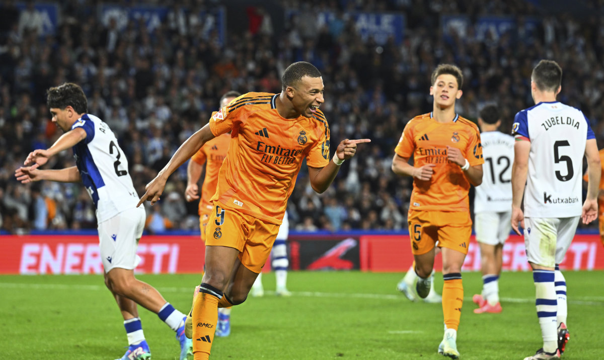Real Madrid's Kylian Mbappe celebrates after scoring his side's second goal from a penalty kick during a Spanish La Liga soccer match between Real Sociedad and Real Madrid at the Reale Arena in San Sebastian, Spain, Saturday, Sept. 14, 2024. (AP)