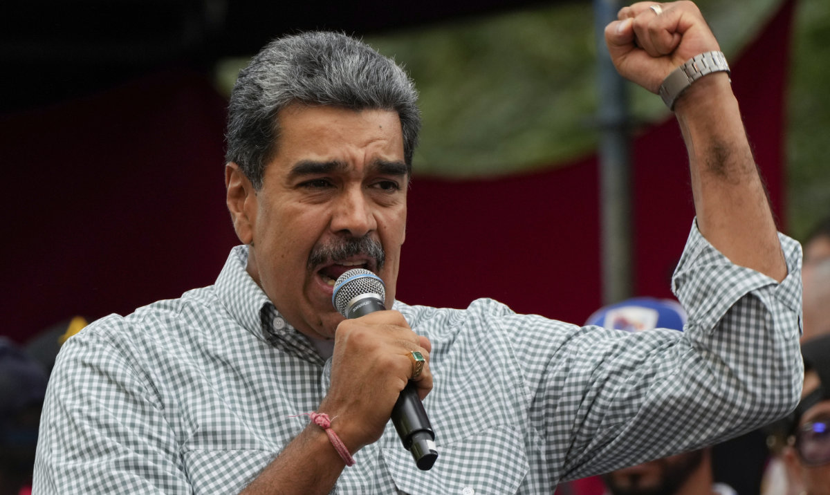 Venezuela's President Nicolas Maduro addresses government loyalists gathered at the presidential palace in Caracas, Venezuela. (AP/File)