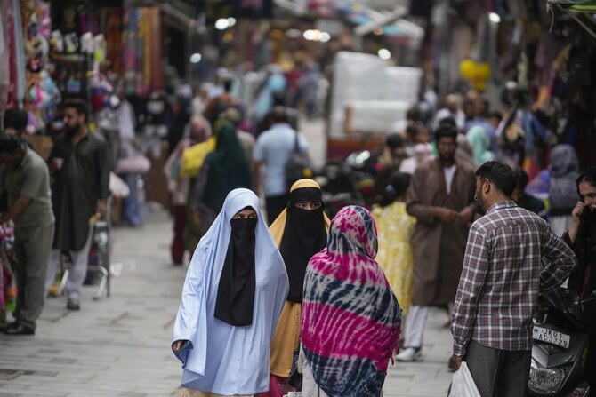 People walk at a busy market in Srinagar, Indian-controlled Kashmir on Aug. 16, 2024. (File/AP)