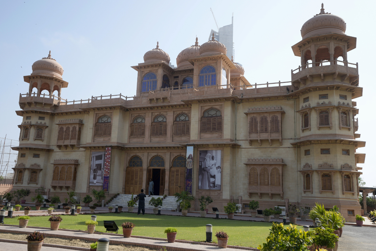 A visitor takes a picture with his mobile phone of historical building "Mohatta Palace," which was built in 1920s and has since been turned into a museum, in Karachi, Pakistan, Friday, May 24, 2024. (AP)