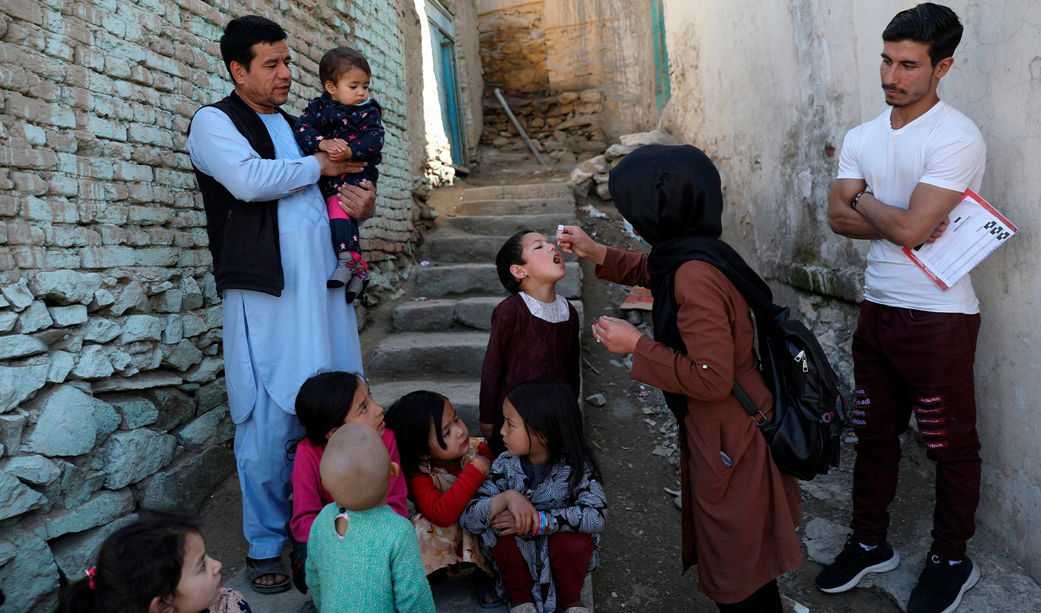 Shabana Maani, gives a polio vaccination to a child in the old part of Kabul, Afghanistan, on March 29, 2021. (AP/File)