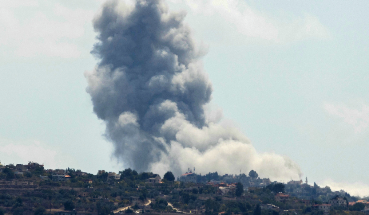 Smoke billows from the site of an Israeli airstrike that targeted the southern Lebanese village of Houla on September 16, 2024. (AFP)